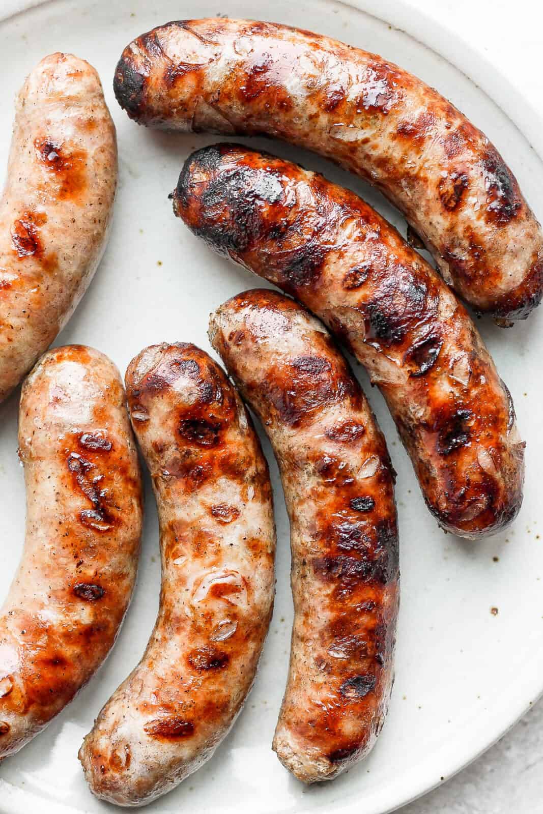 Beer brats on a plate.