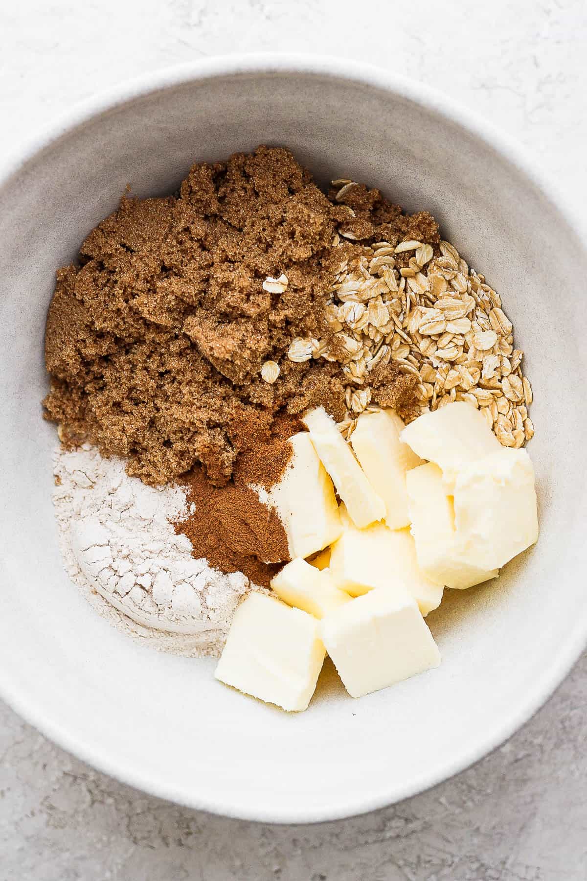 The ingredients for the crisp in a mixing bowl.