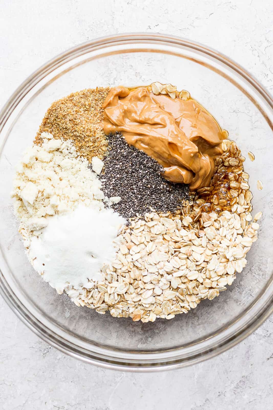 A bowl of ingredients for no bake energy bites before combined. 