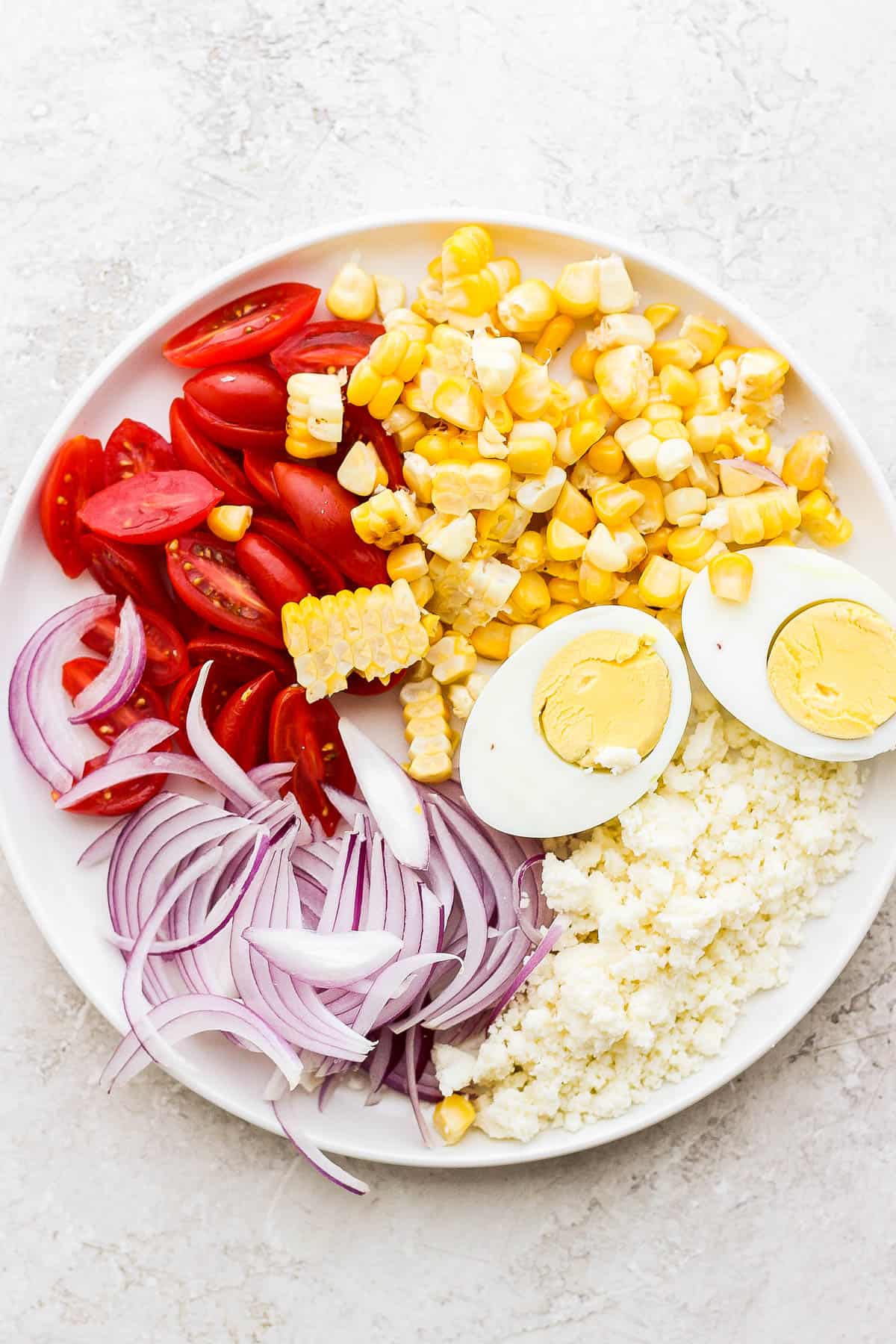 A plate of toppings for the salad.