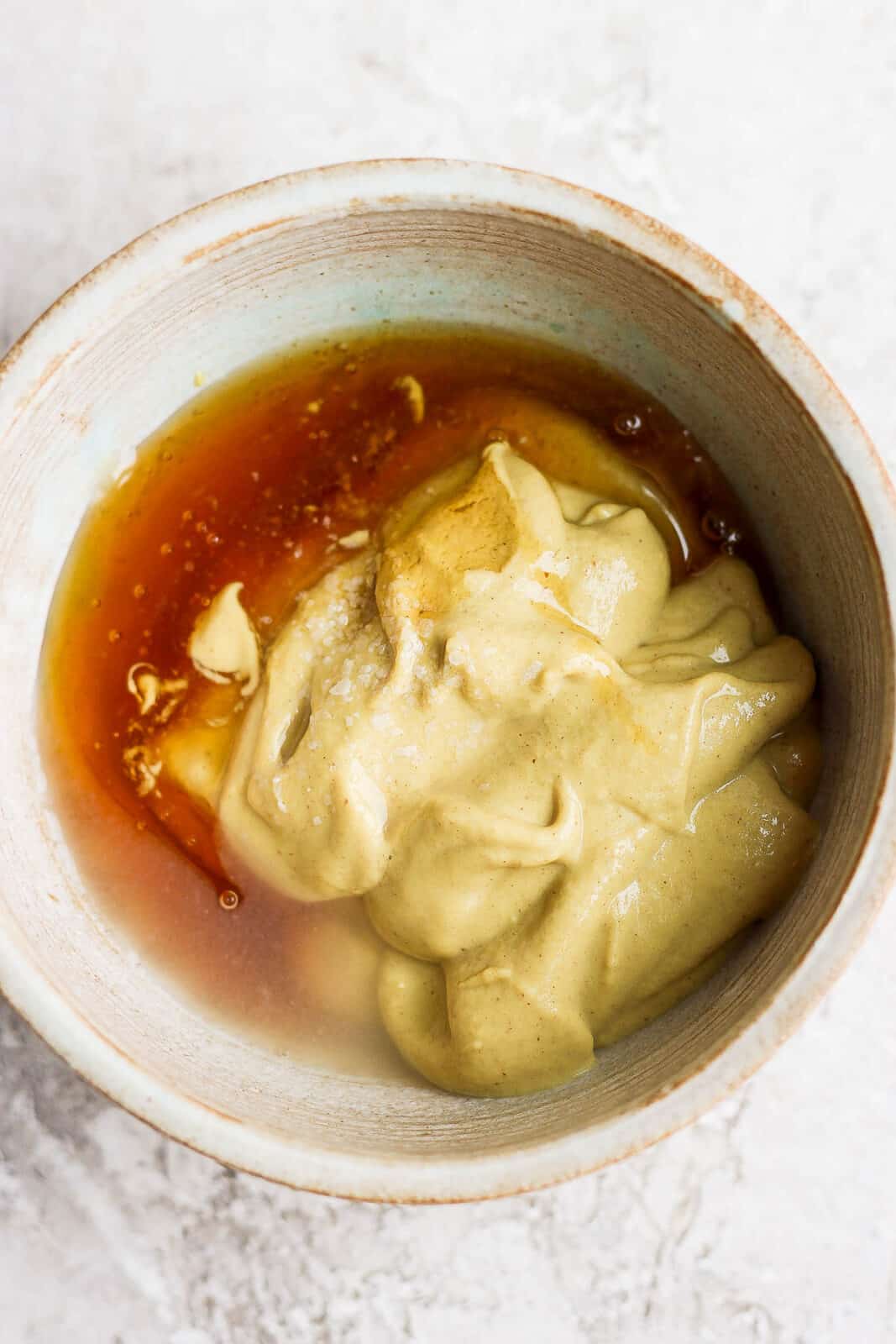 Honey mustard ingredients in a mixing bowl.