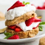 Healthy Strawberry Shortcake on a plate with basil garnish.