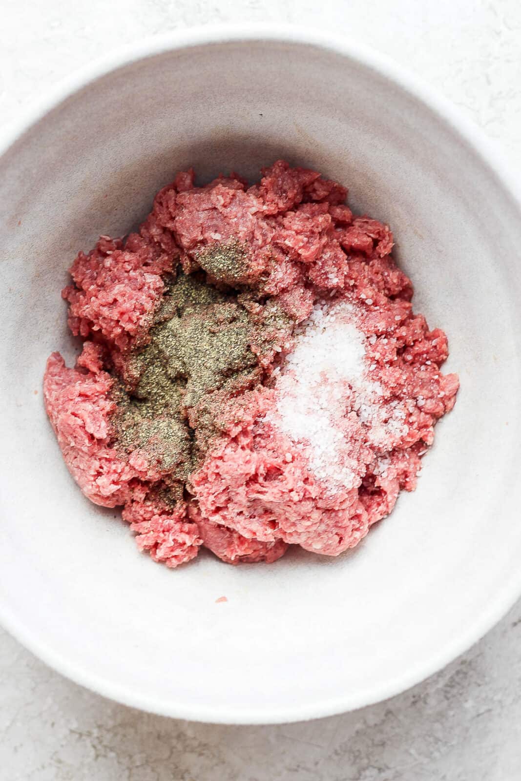 Ground bison meat with salt and pepper.