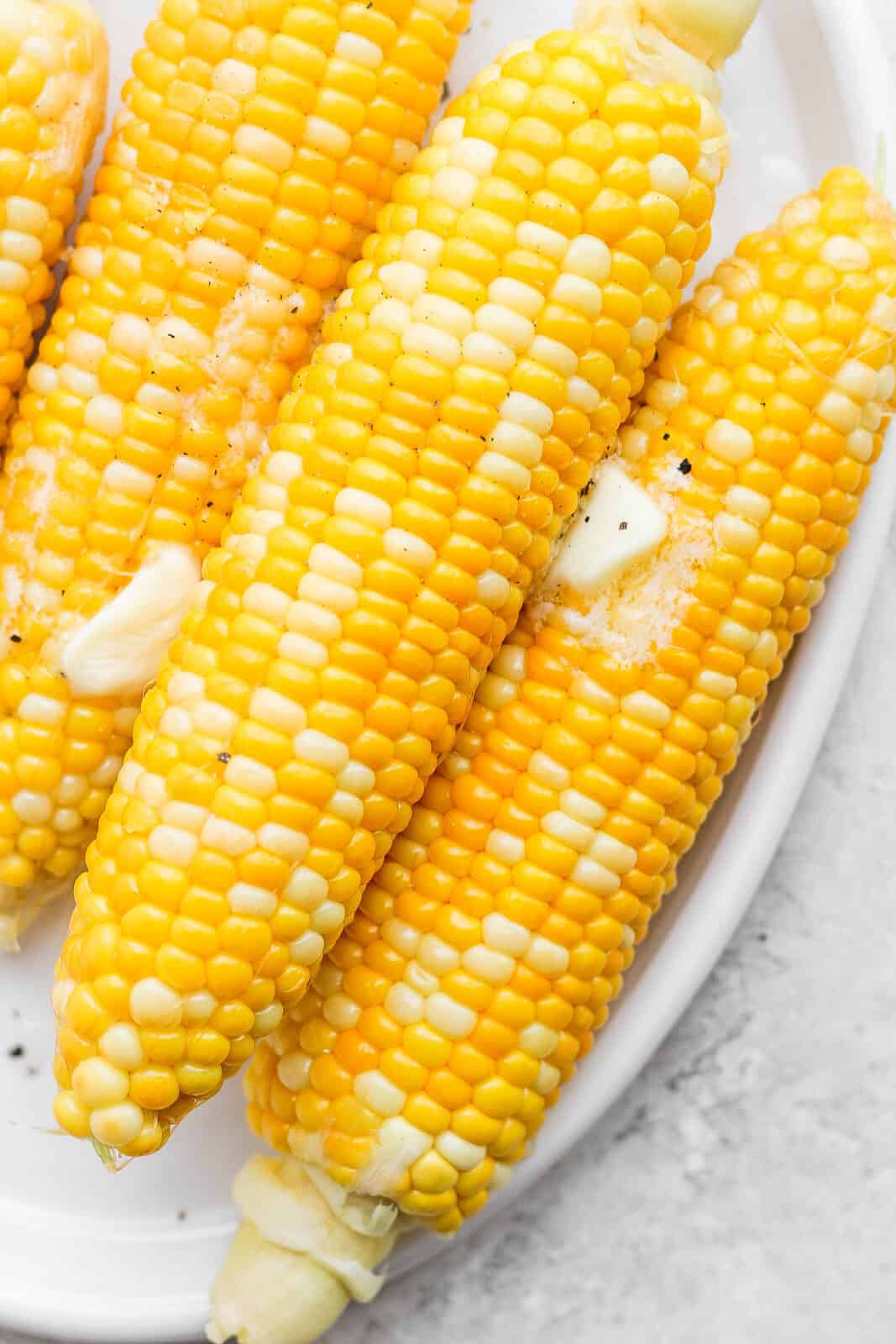 Boiled corn with butter, salt, and pepper.