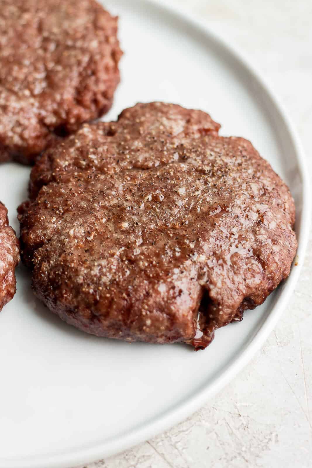 Close up of a smoked burger on a plate. 