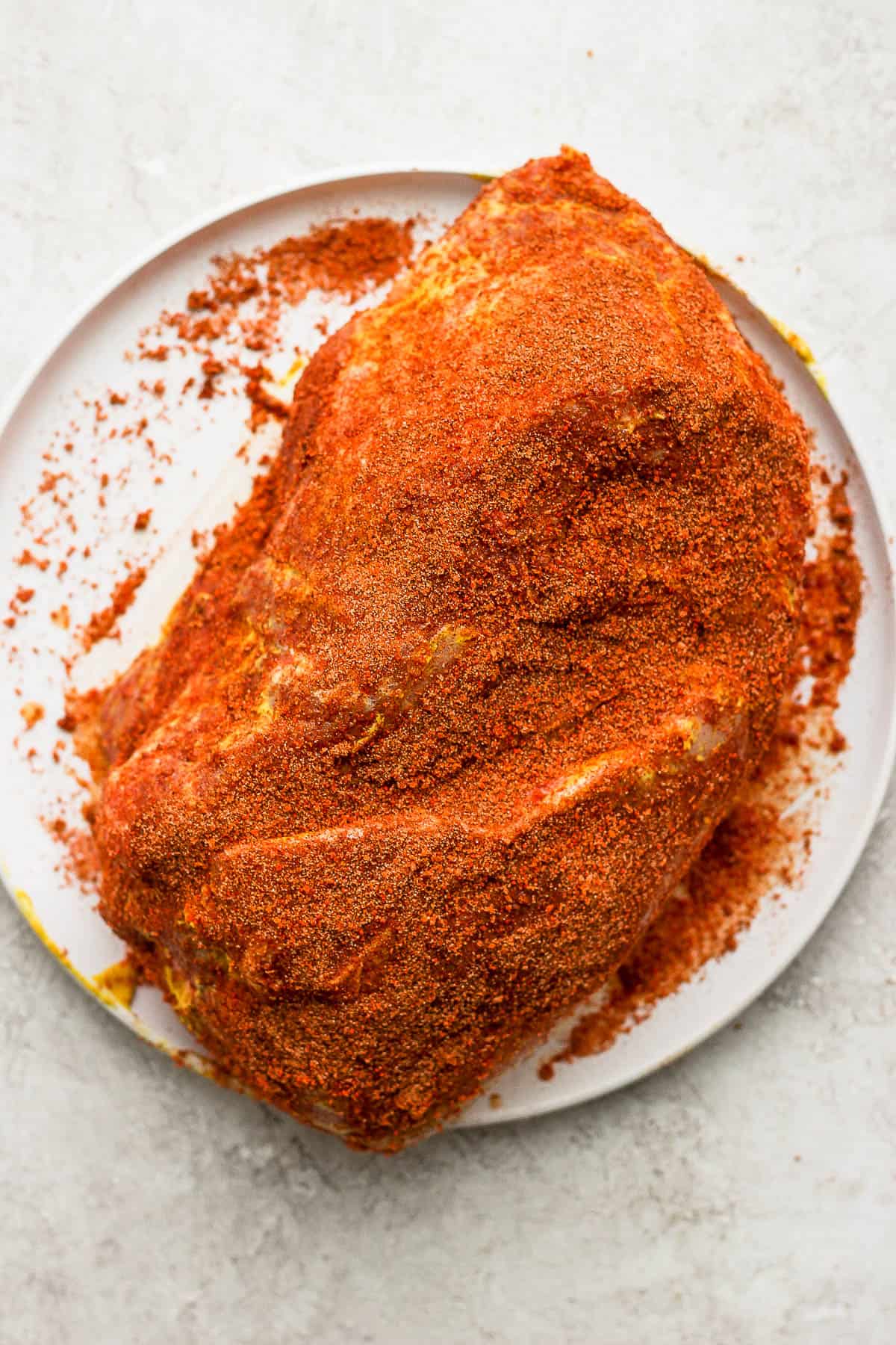 Pork dry rub now rubbed all over the pork butt.