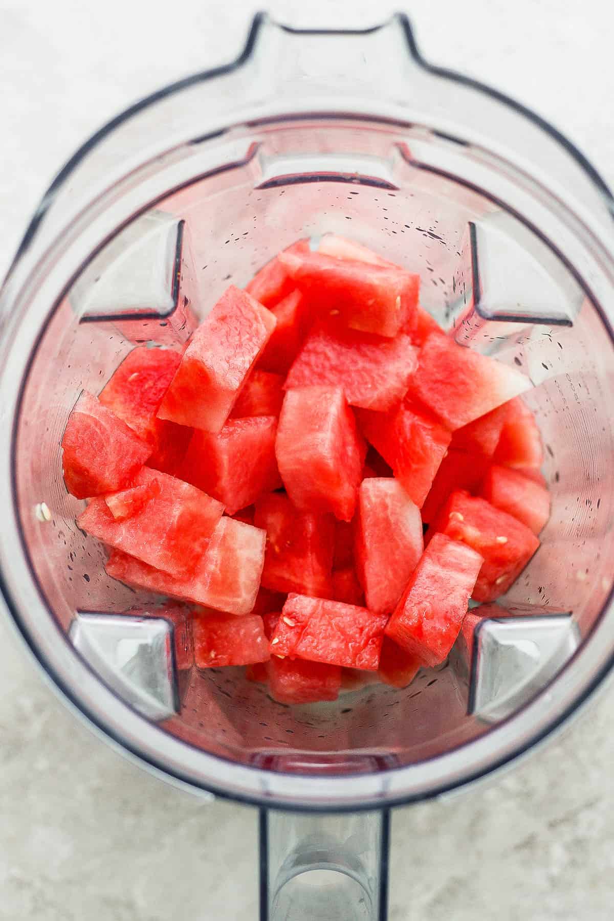 Cut-up watermelon in a blender.