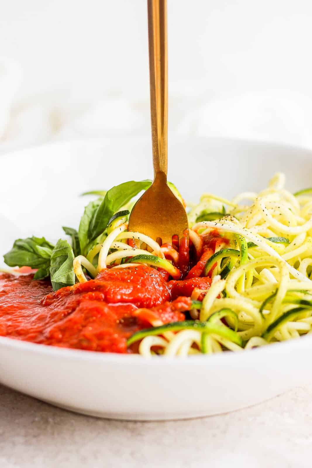 A fork in the zucchini spaghetti.