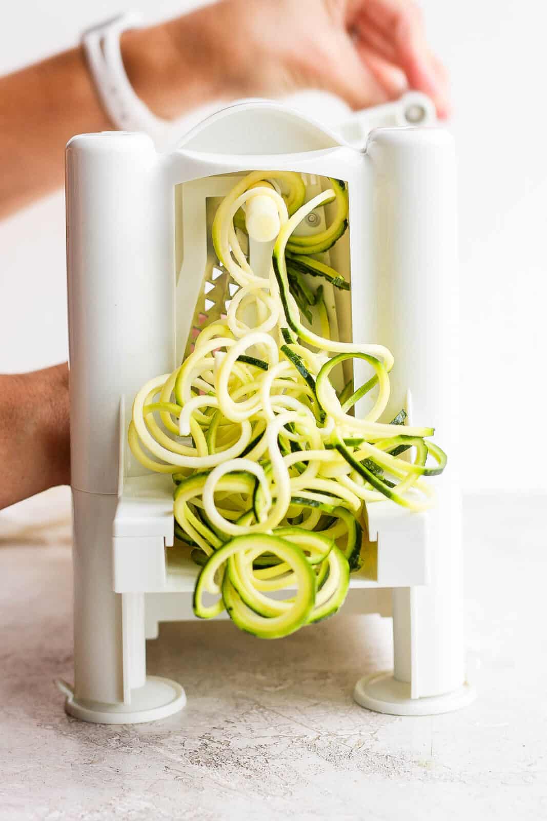 Zucchini being spiralized.