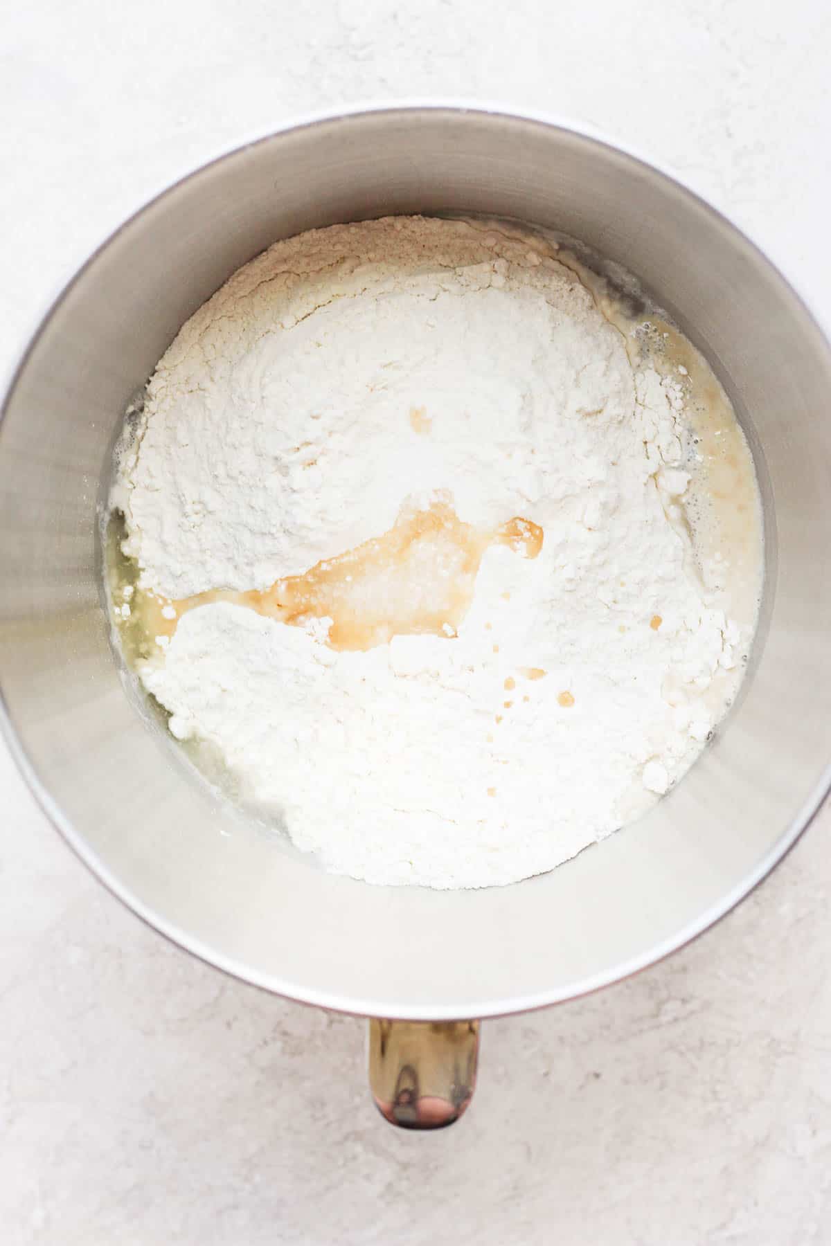 Flour and oil have been added to the bowl. 