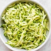 A bowl of grated zucchini.