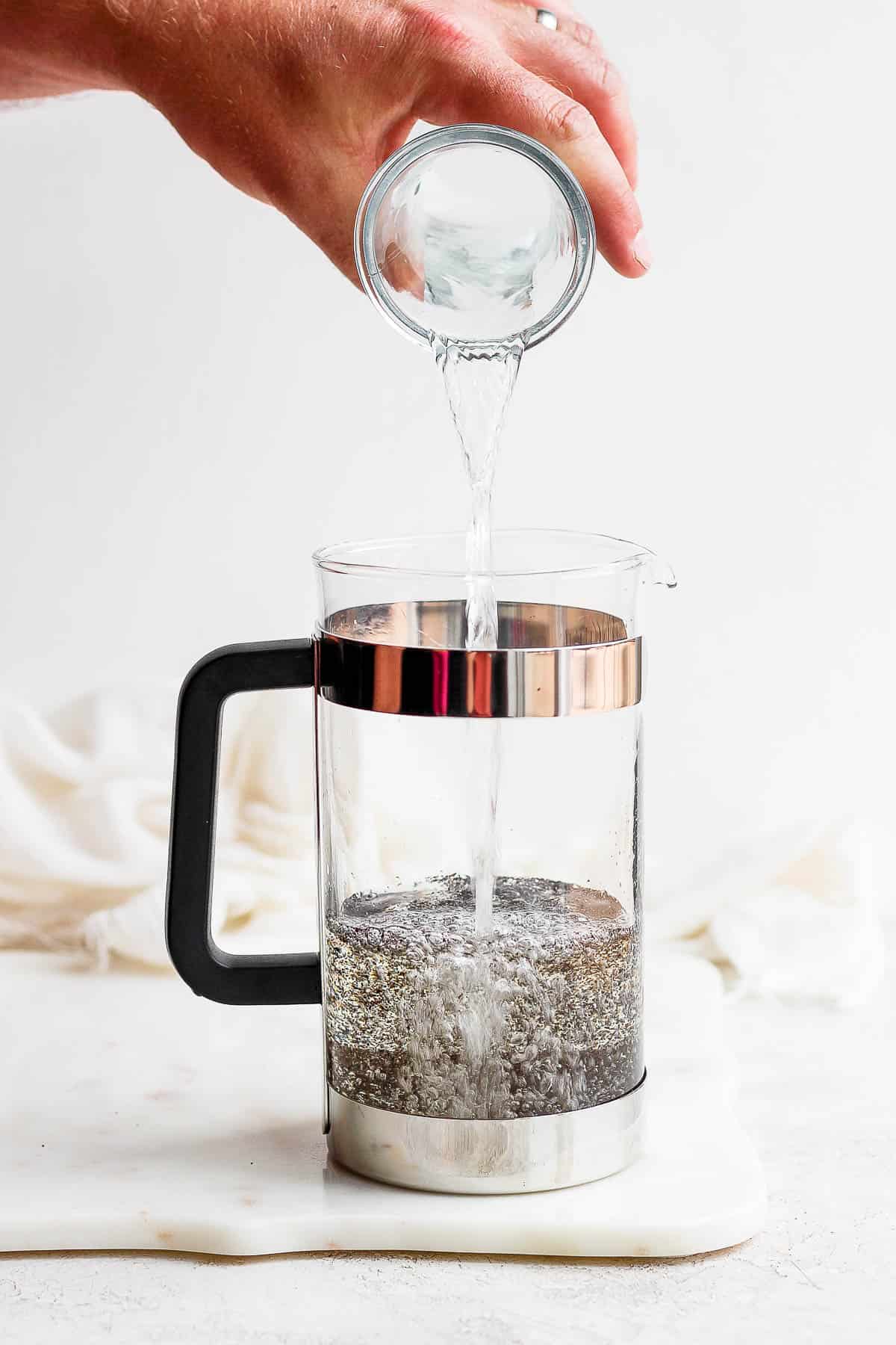 Water being poured into a french press.