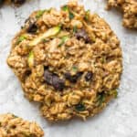 A zucchini cookie on a piece of crumpled parchment paper.