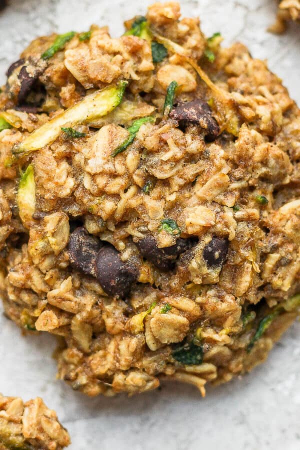 A zucchini cookie on a piece of crumpled parchment paper.