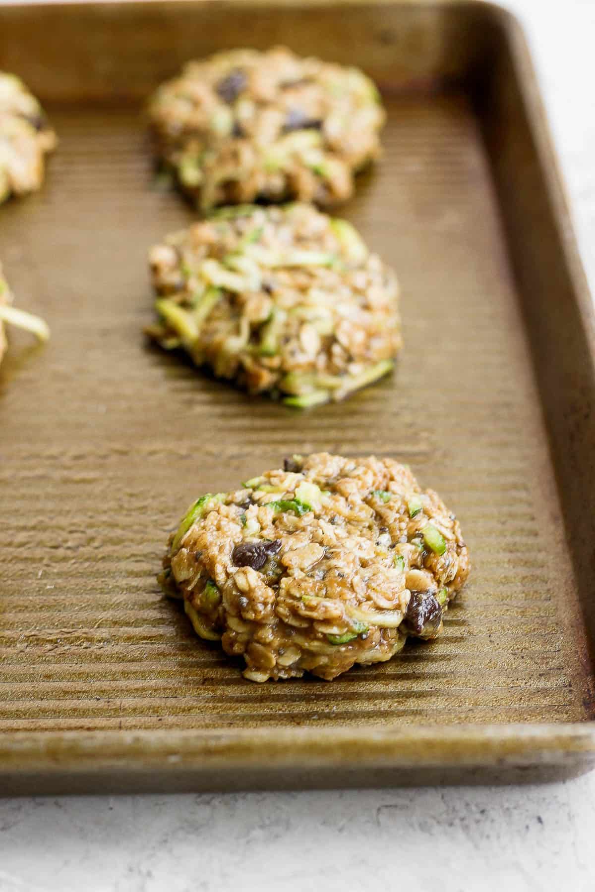 Zucchini cookies on a baking sheet.