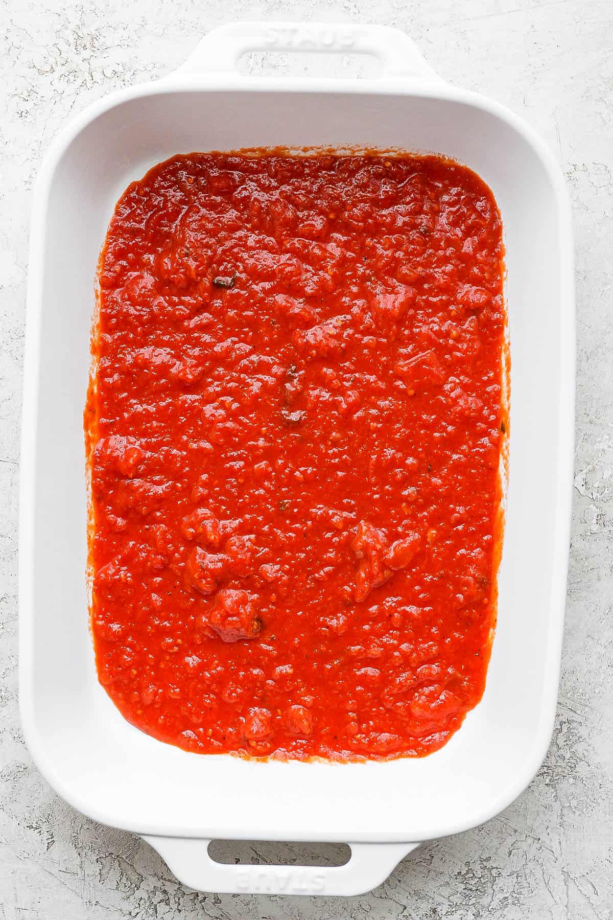 Half of the meat sauce placed in a 9x13 baking dish. 