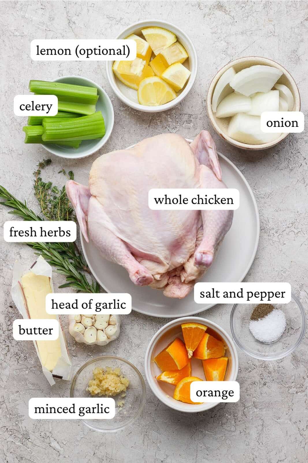 Ingredients for a dutch oven whole roasted chicken in separate bowls and labeled.