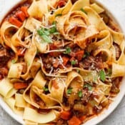 Bowl of lamb ragu with pappardelle pasta.