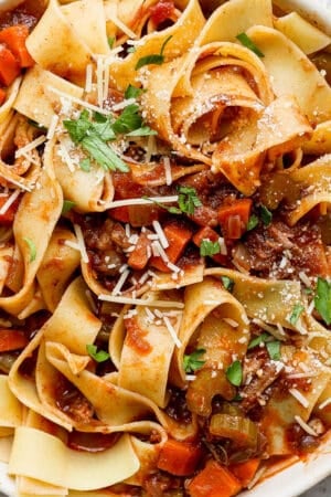 Bowl of lamb ragu with pappardelle pasta.