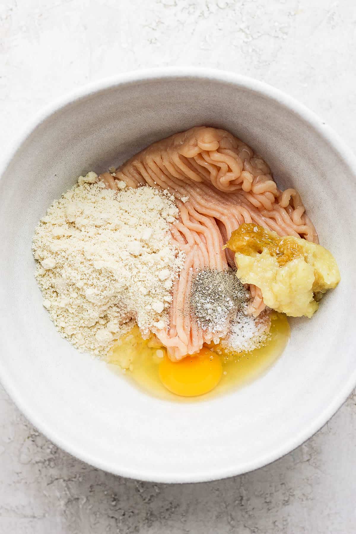 Ginger chicken meatball ingredients in a bowl.