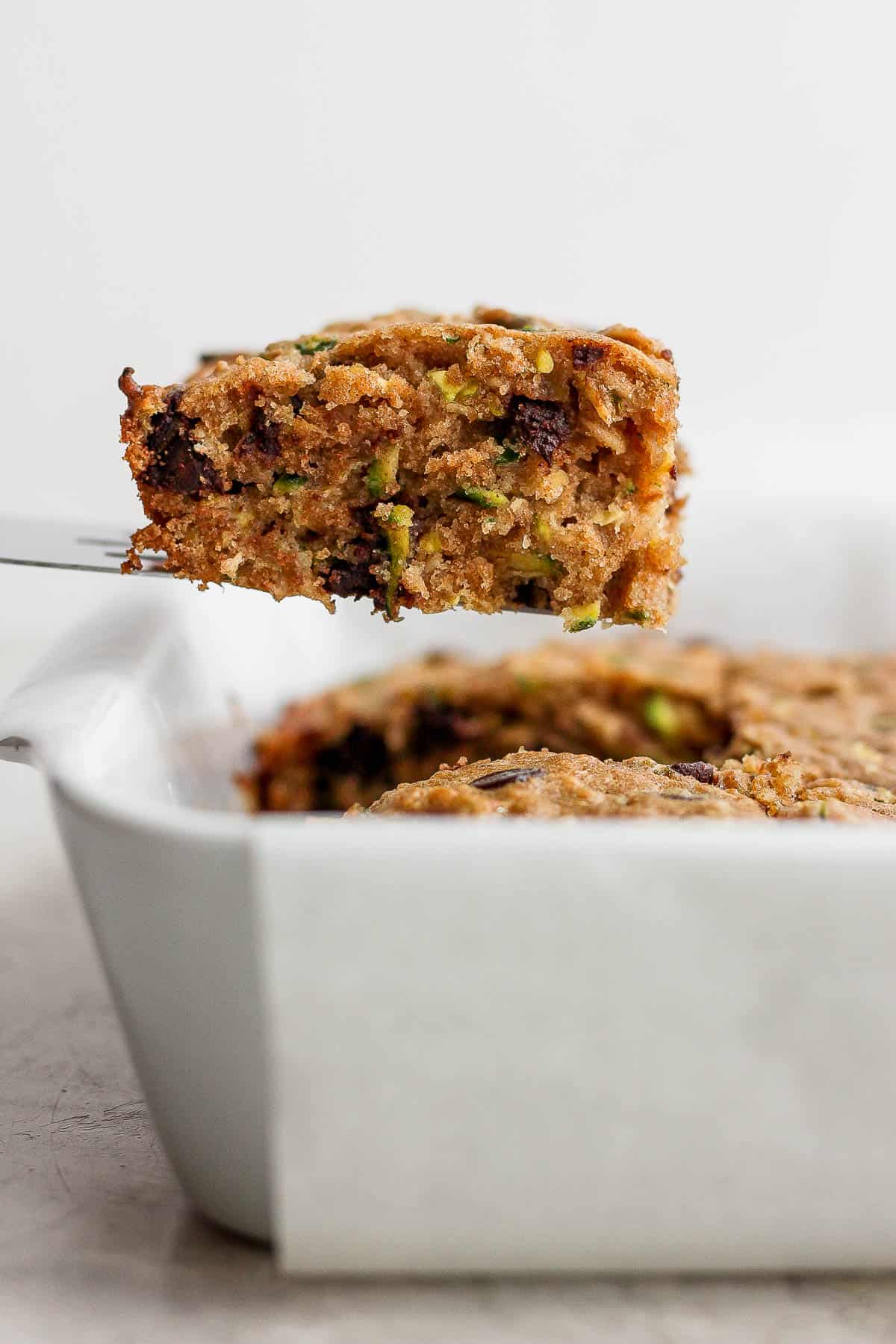 A small spatula scooping a bar out of the pan.