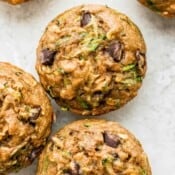 Top shot of several chocolate chip zucchini muffins.