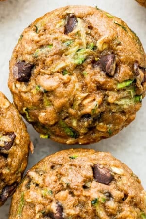 Top shot of several chocolate chip zucchini muffins.
