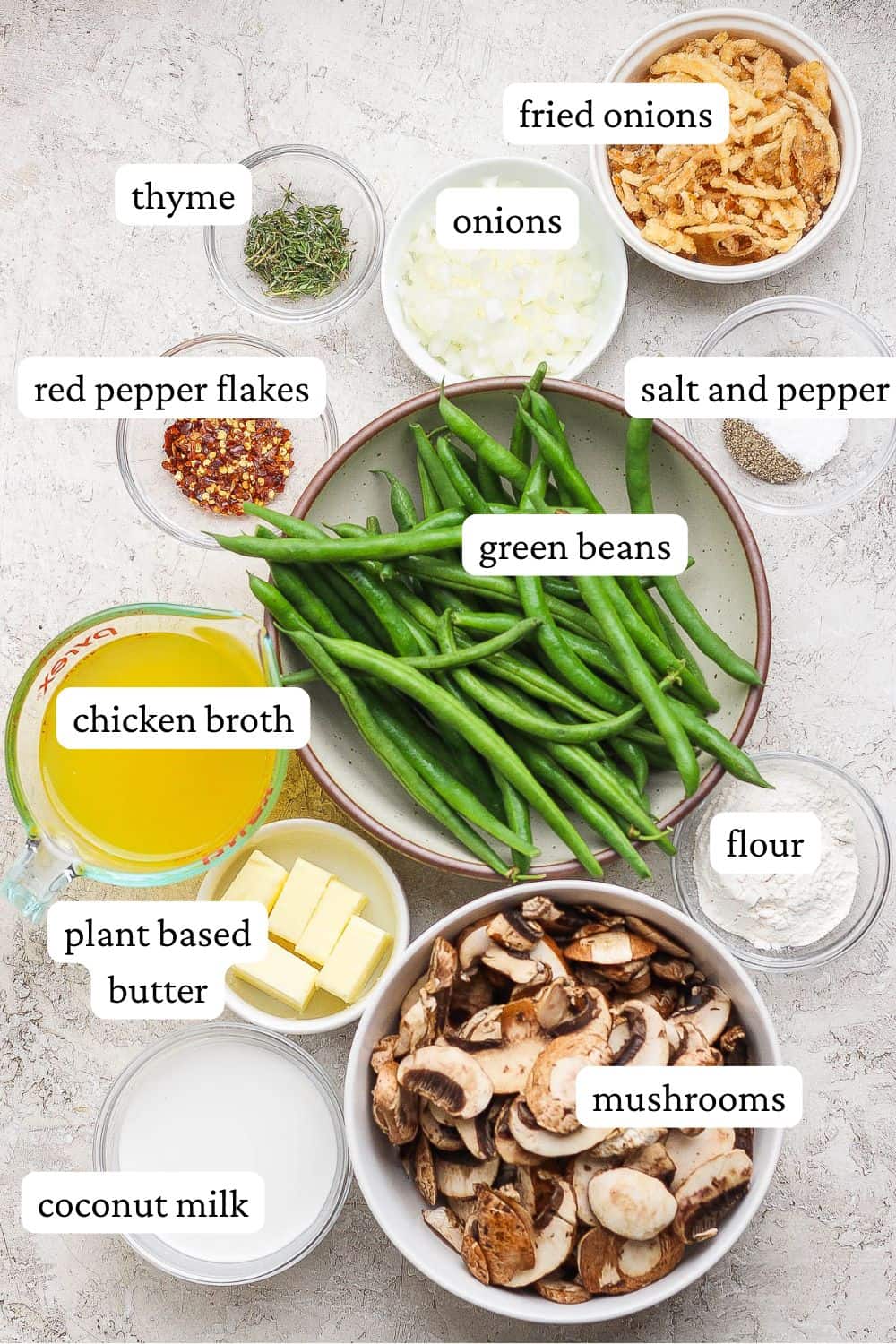 Ingredients for dairy free green bean casserole separated out into individual dishes.