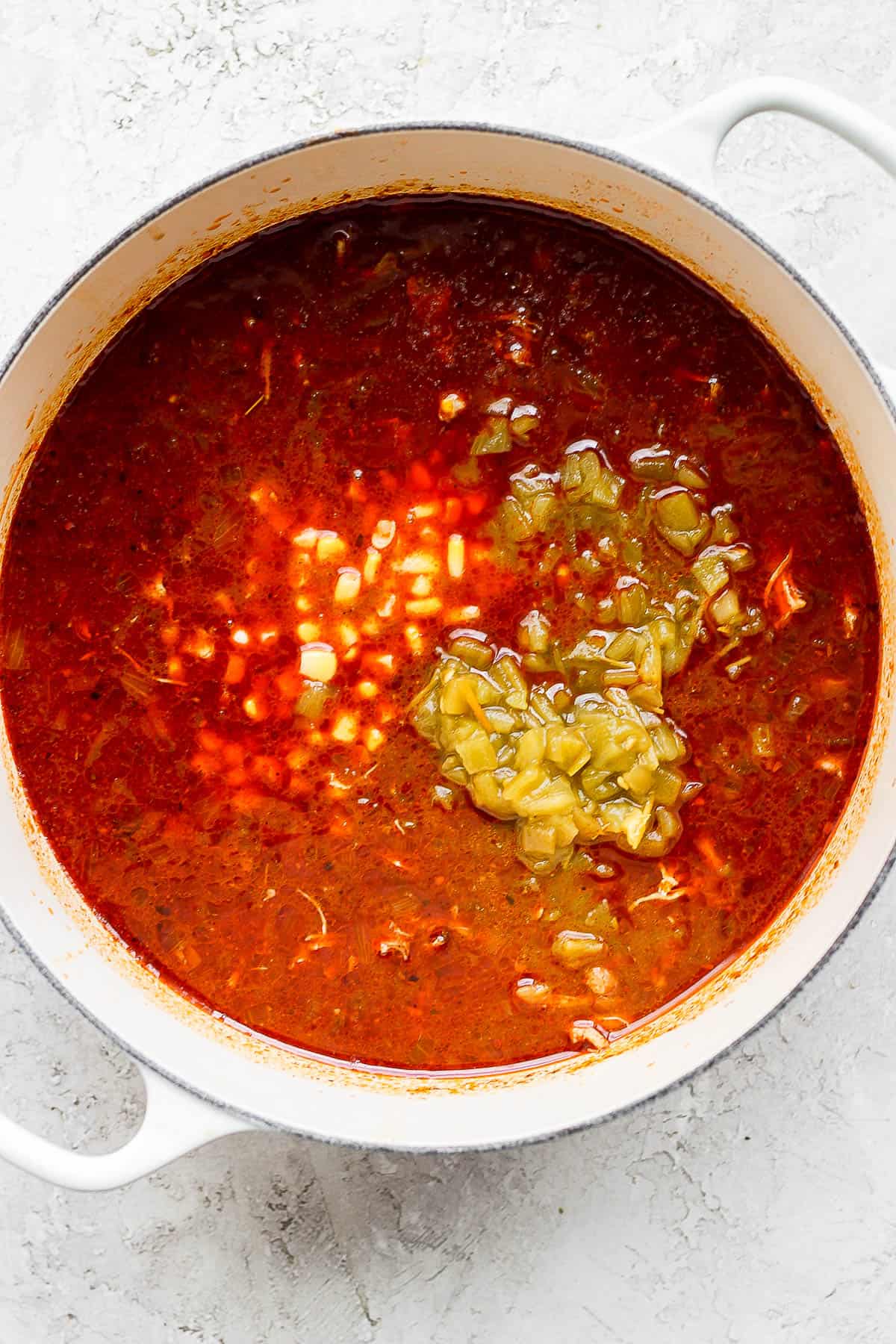 Chiles, corn, and beans added to the soup mixture. 