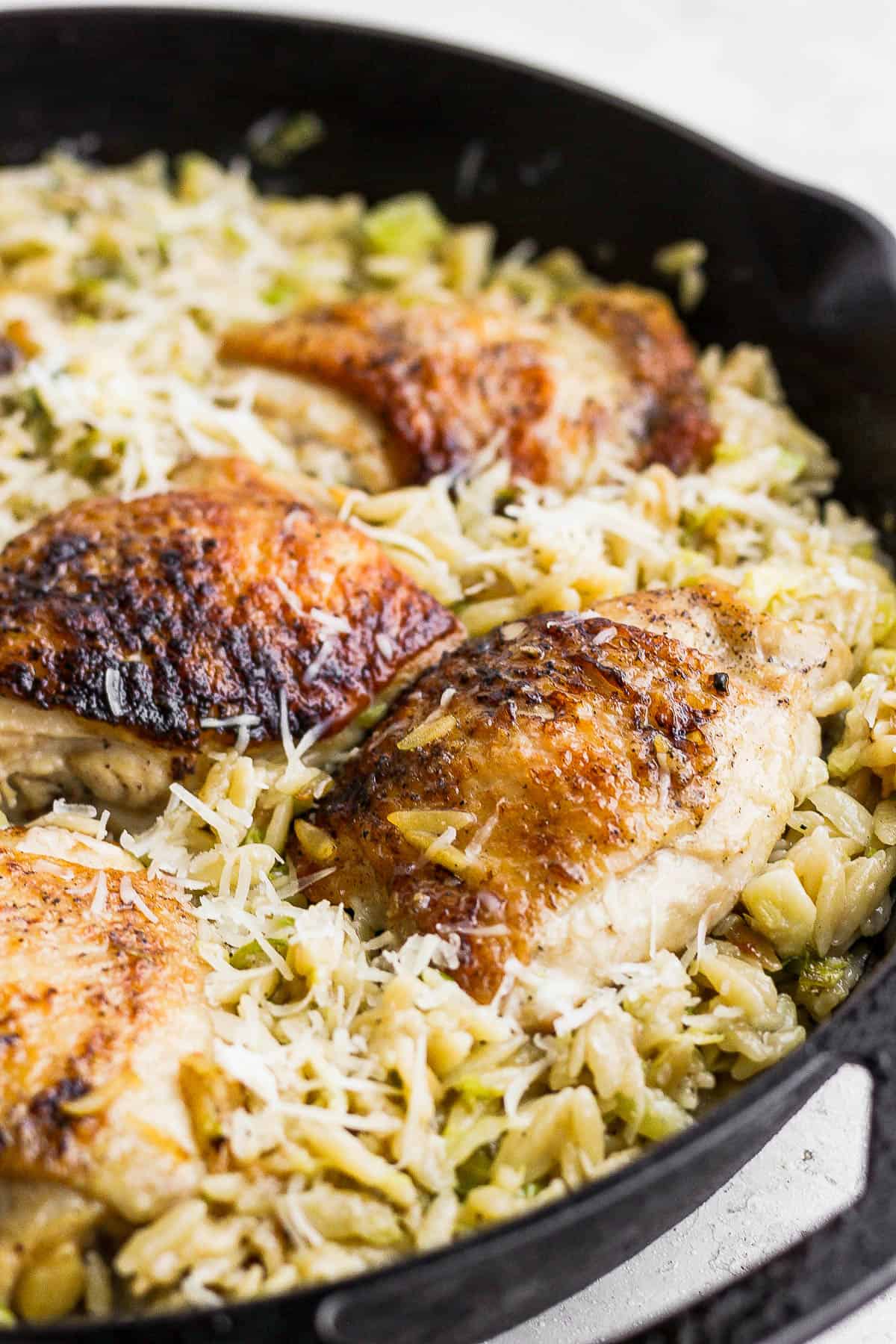 Parmesan chicken orzo in the cast iron skillet.