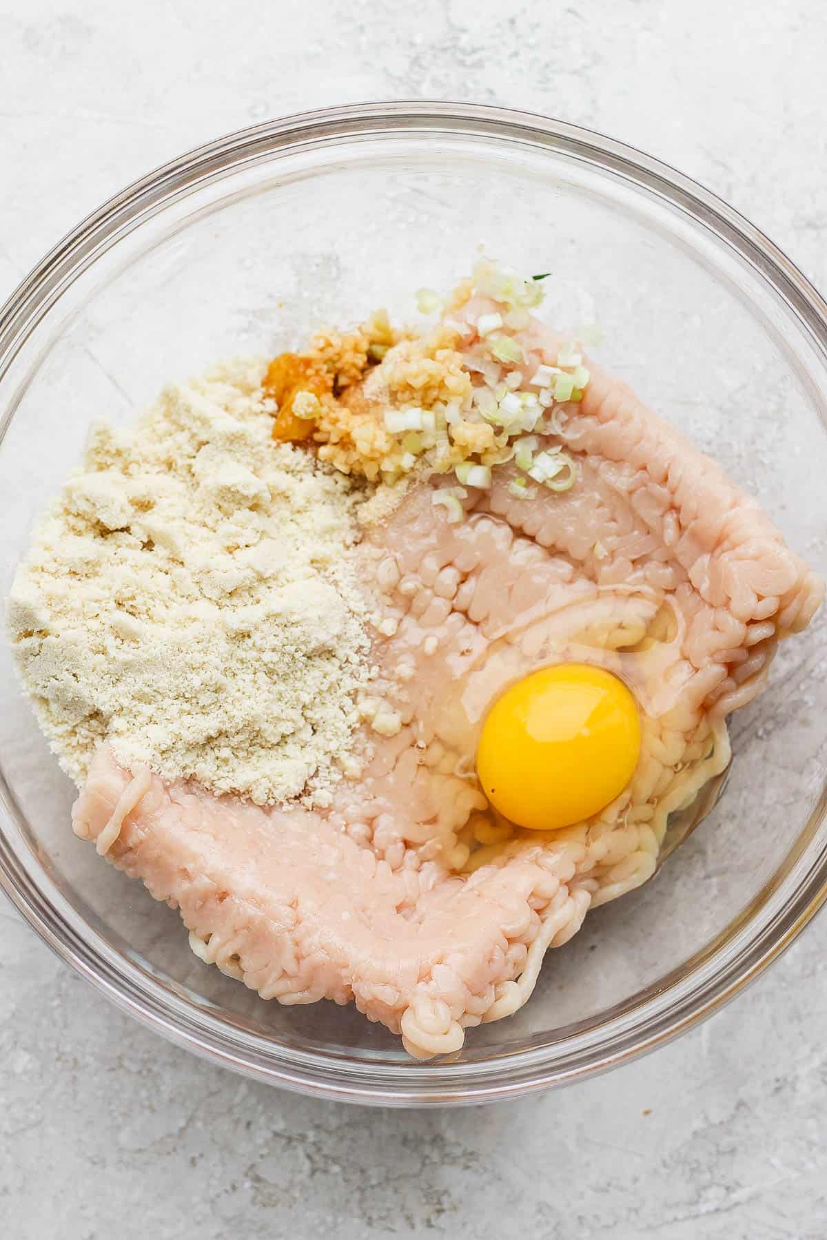 Meatball ingredients in a mixing bowl.