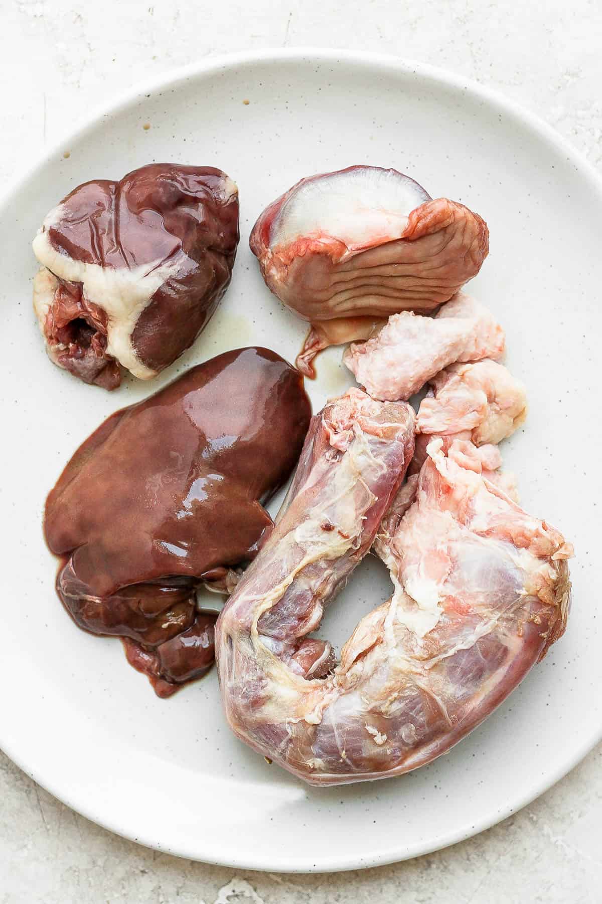 Turkey giblets on a white plate.