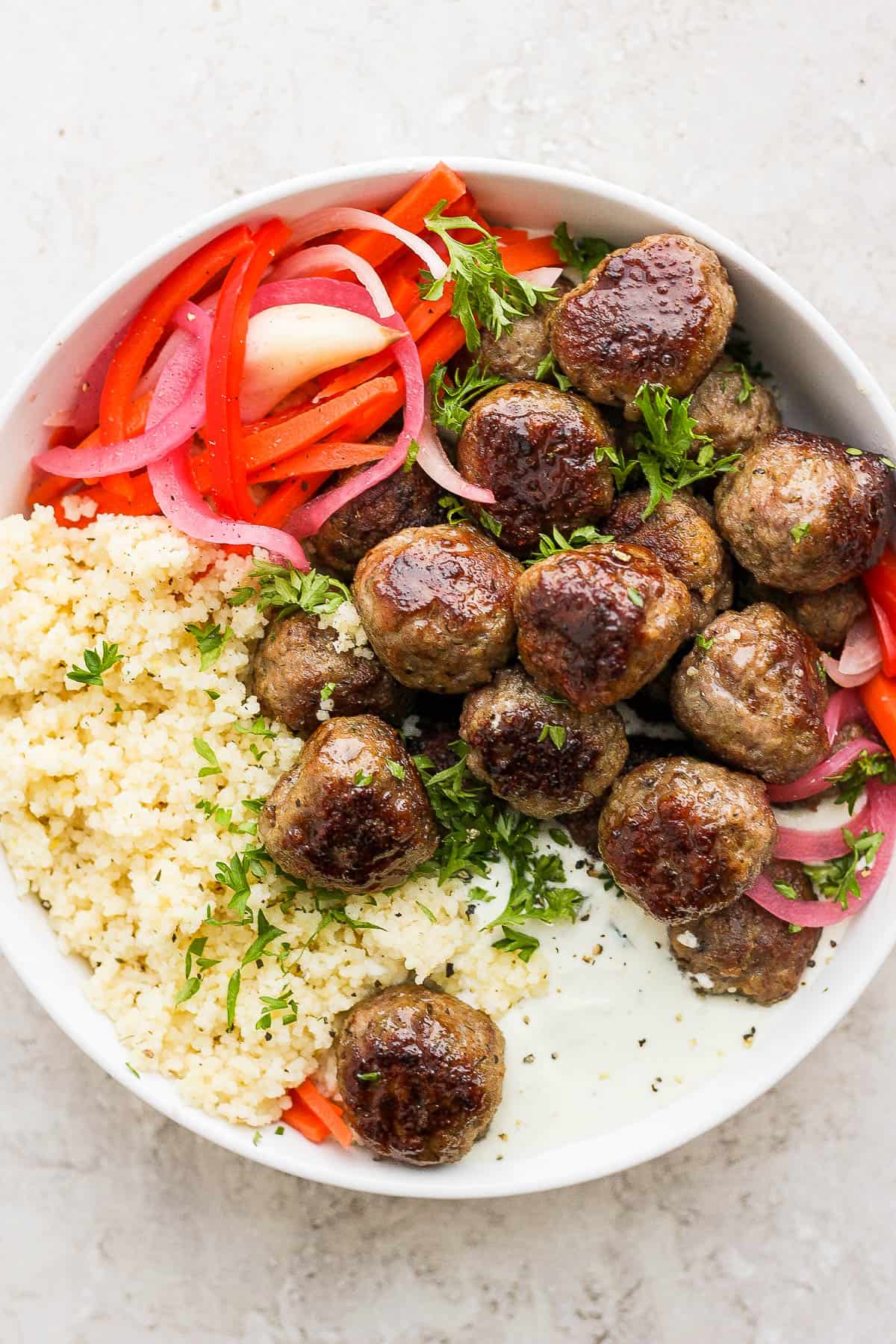 Easy Greek meatballs with quinoa and whipped feta.