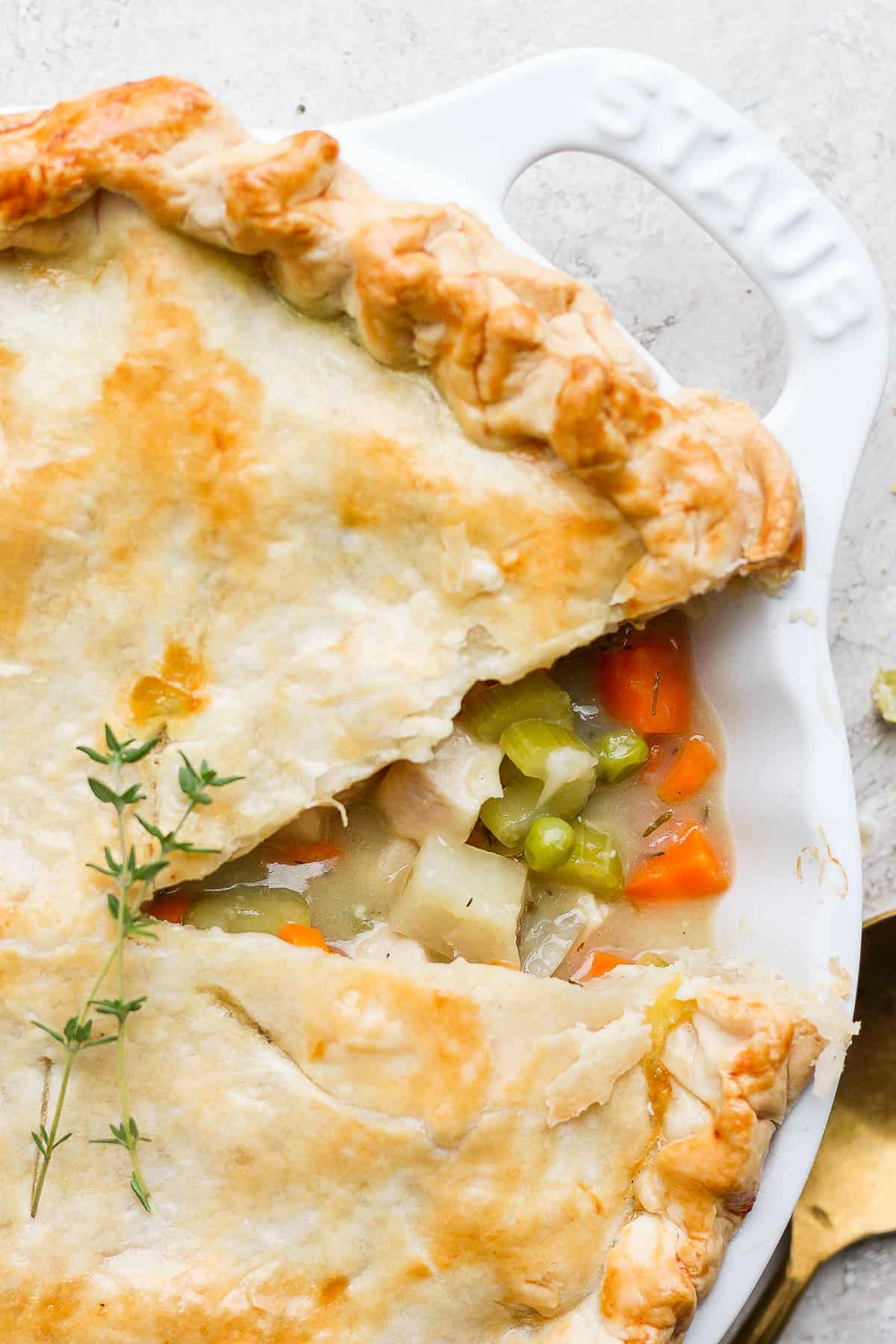 Turkey pot pie with one slice removed.