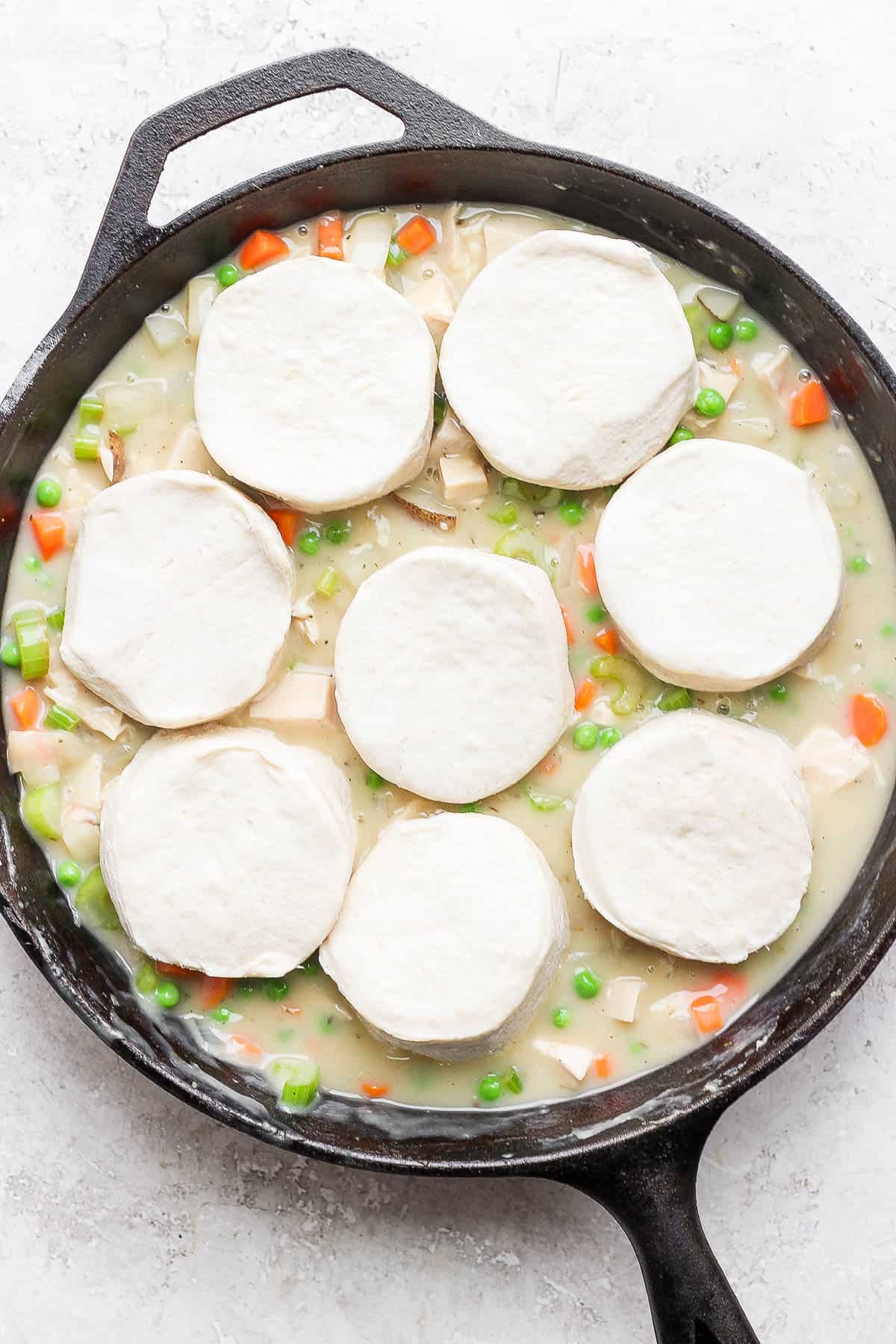 Biscuits placed on top of the turkey filling.