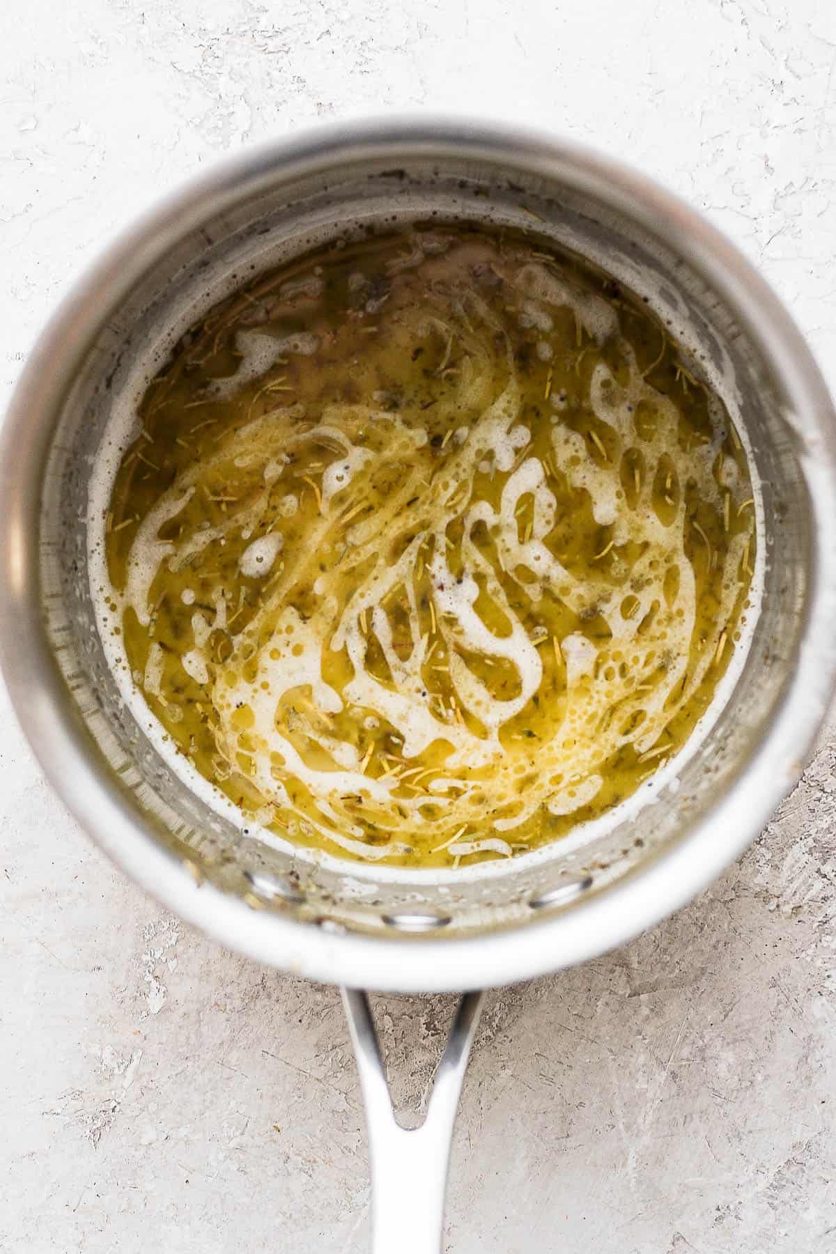 Melted turkey baste in a saucepan.