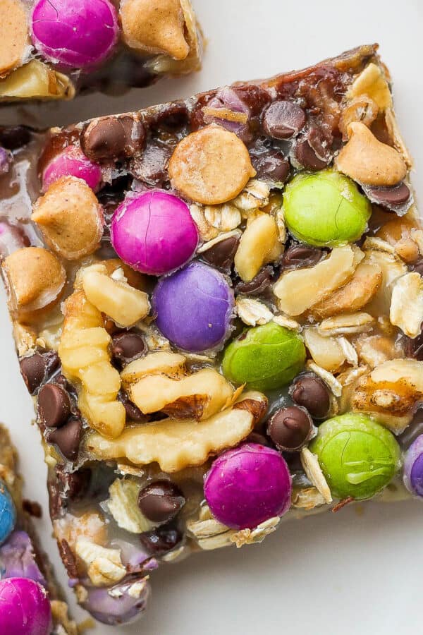A monster cookie magic bar on a plate.