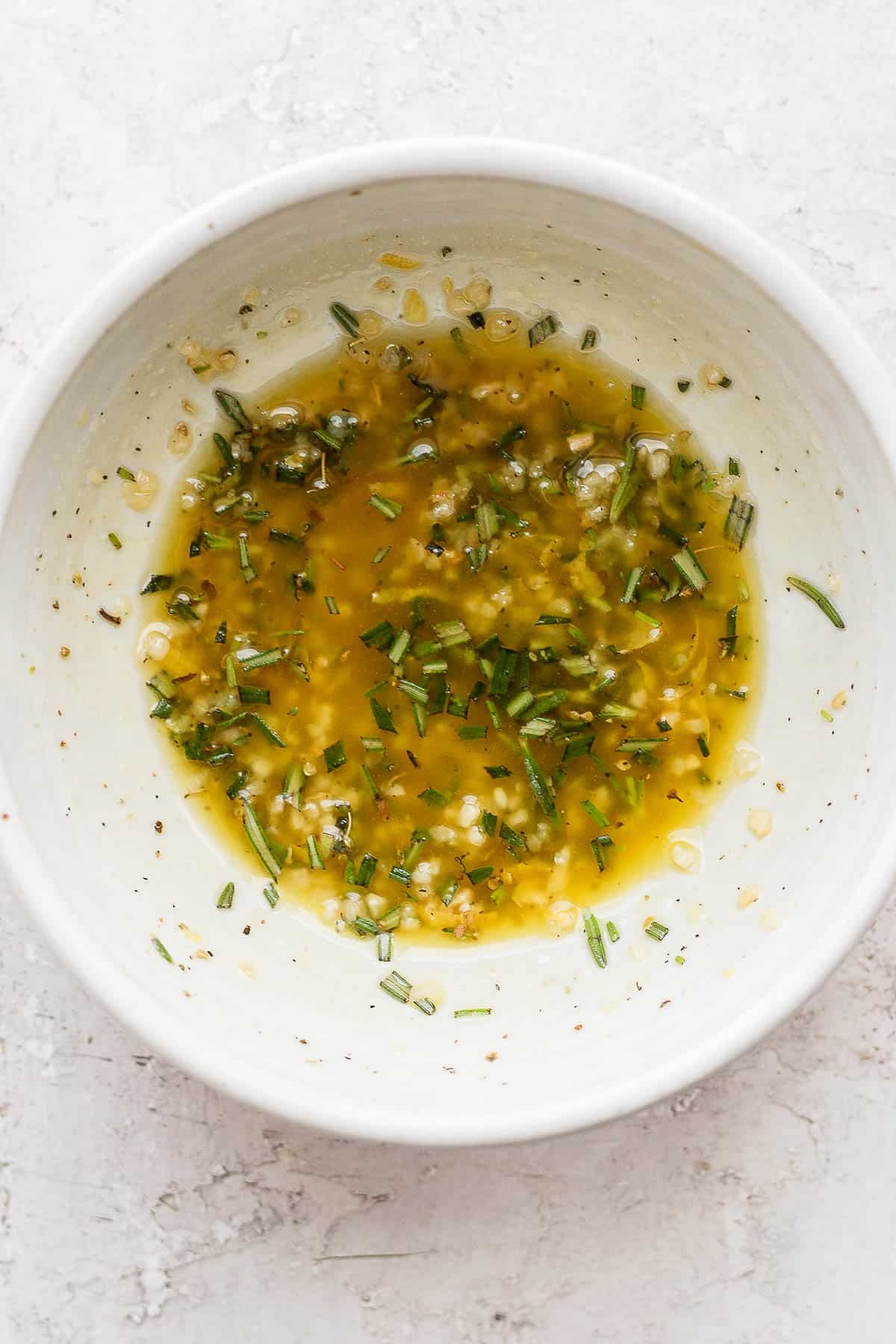 Lamb chop marinade in a small bowl.