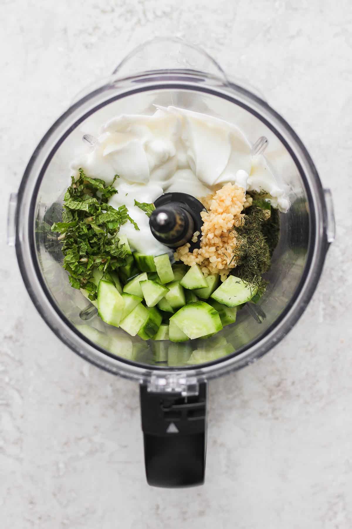 All of the ingredients in a food processor. 