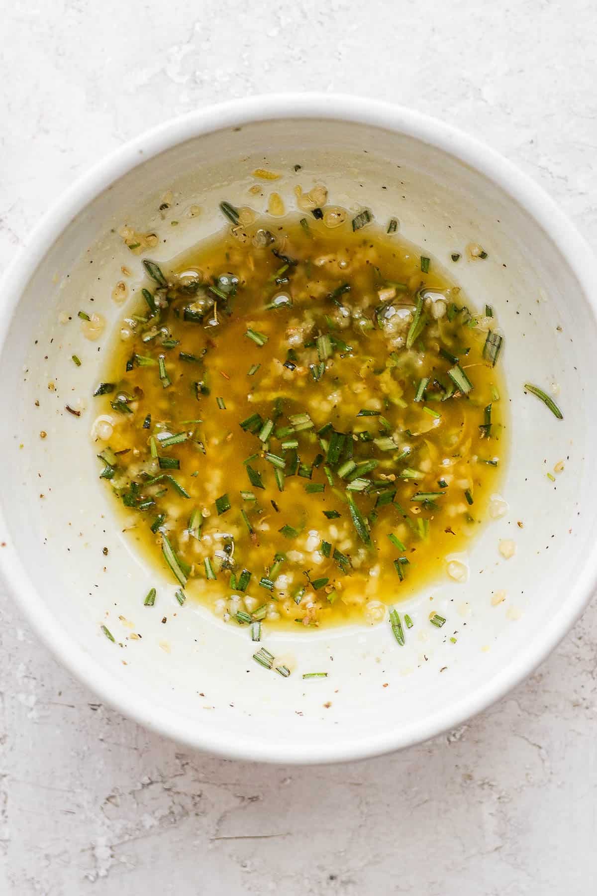 Lamb chop marinade in a small bowl.