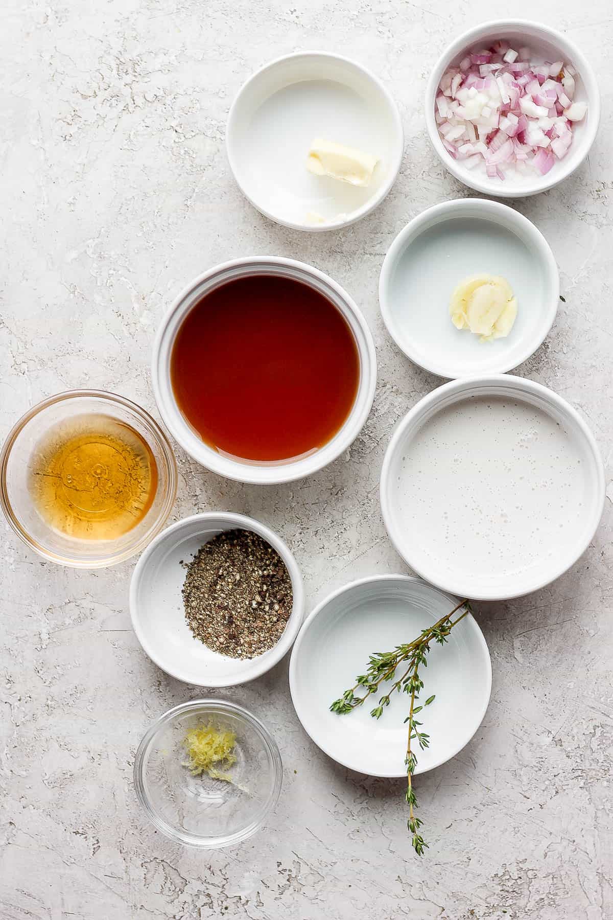 Ingredients for the pan sauce in separate bowls.