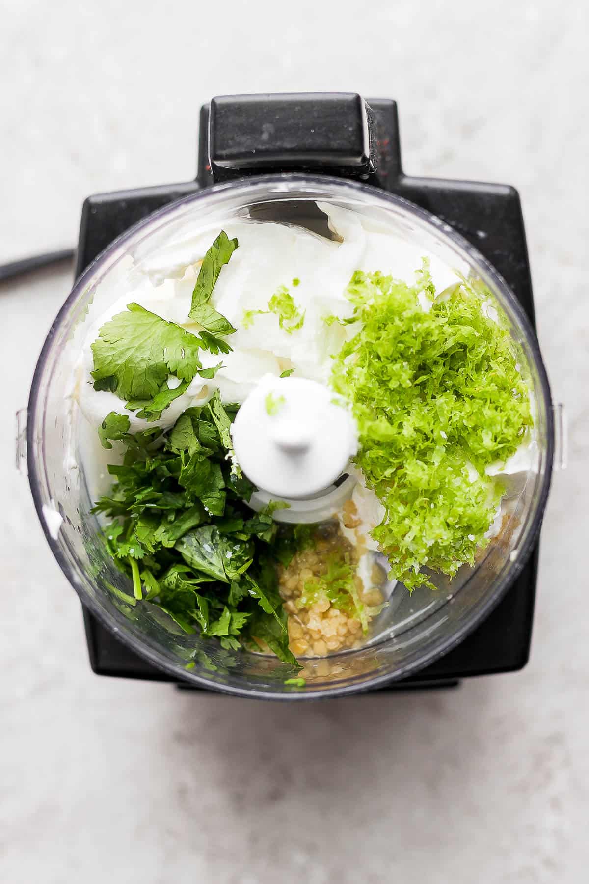 All of the ingredients in a food processor. 