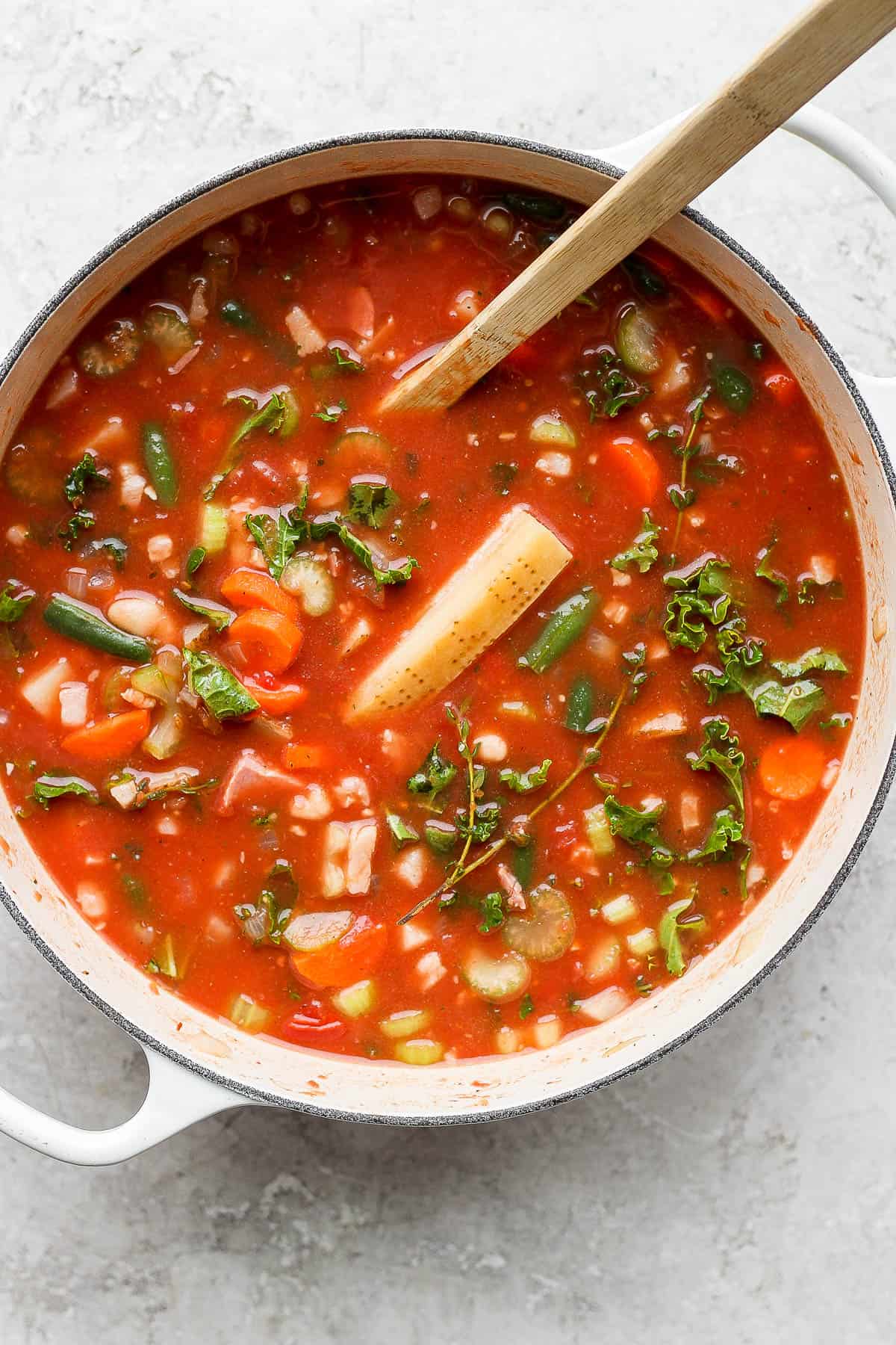 A fully mixed pot of minestrone soup.