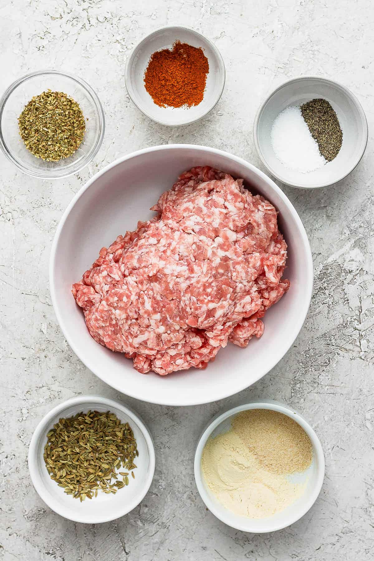 Ingredients for healthy breakfast sausage in separate bowls.