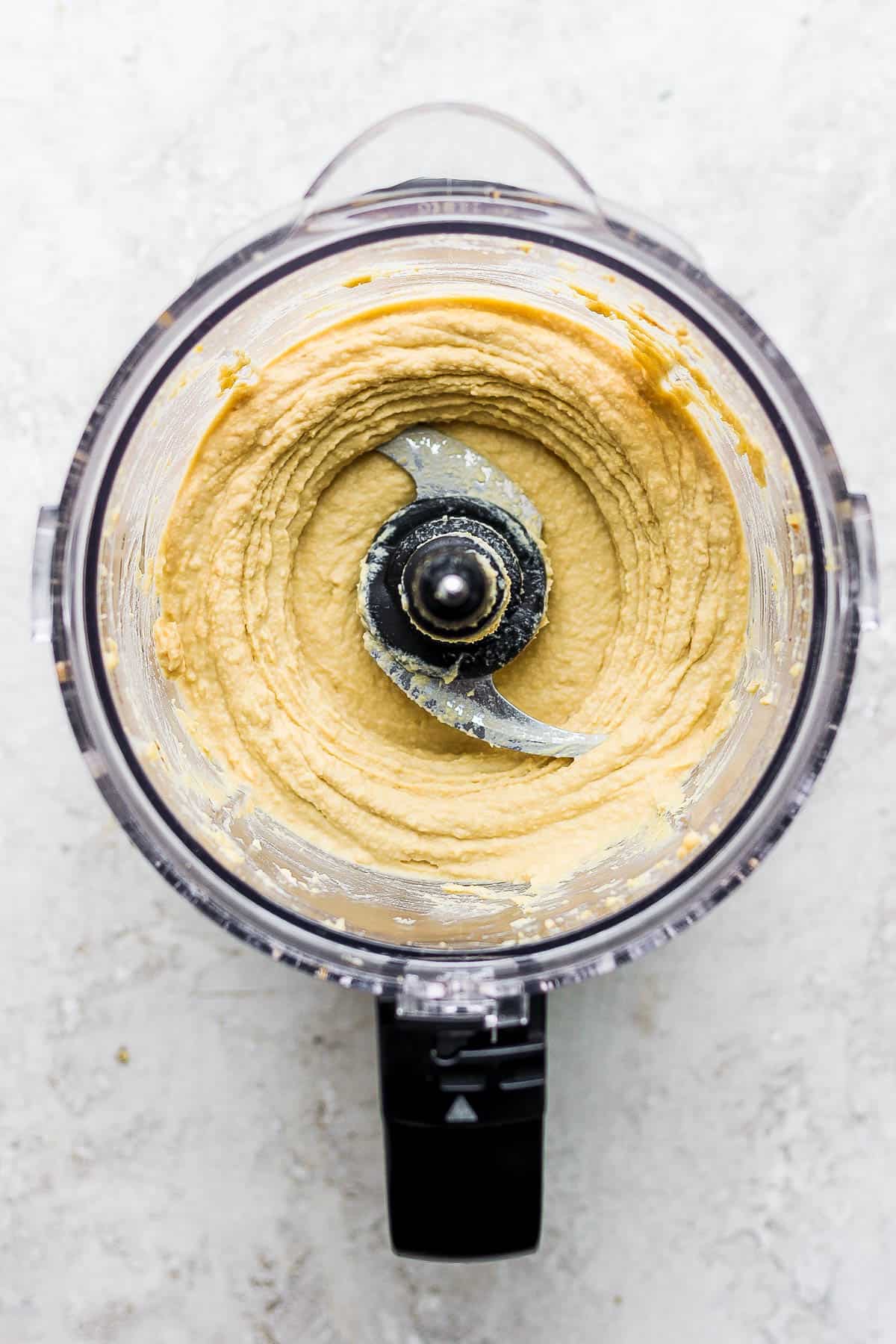 Roasted garlic hummus in a food processor.