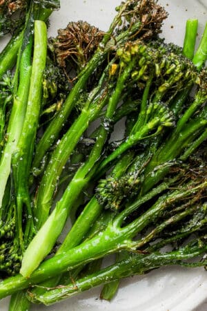 A plate of air fryer broccolini on plate.