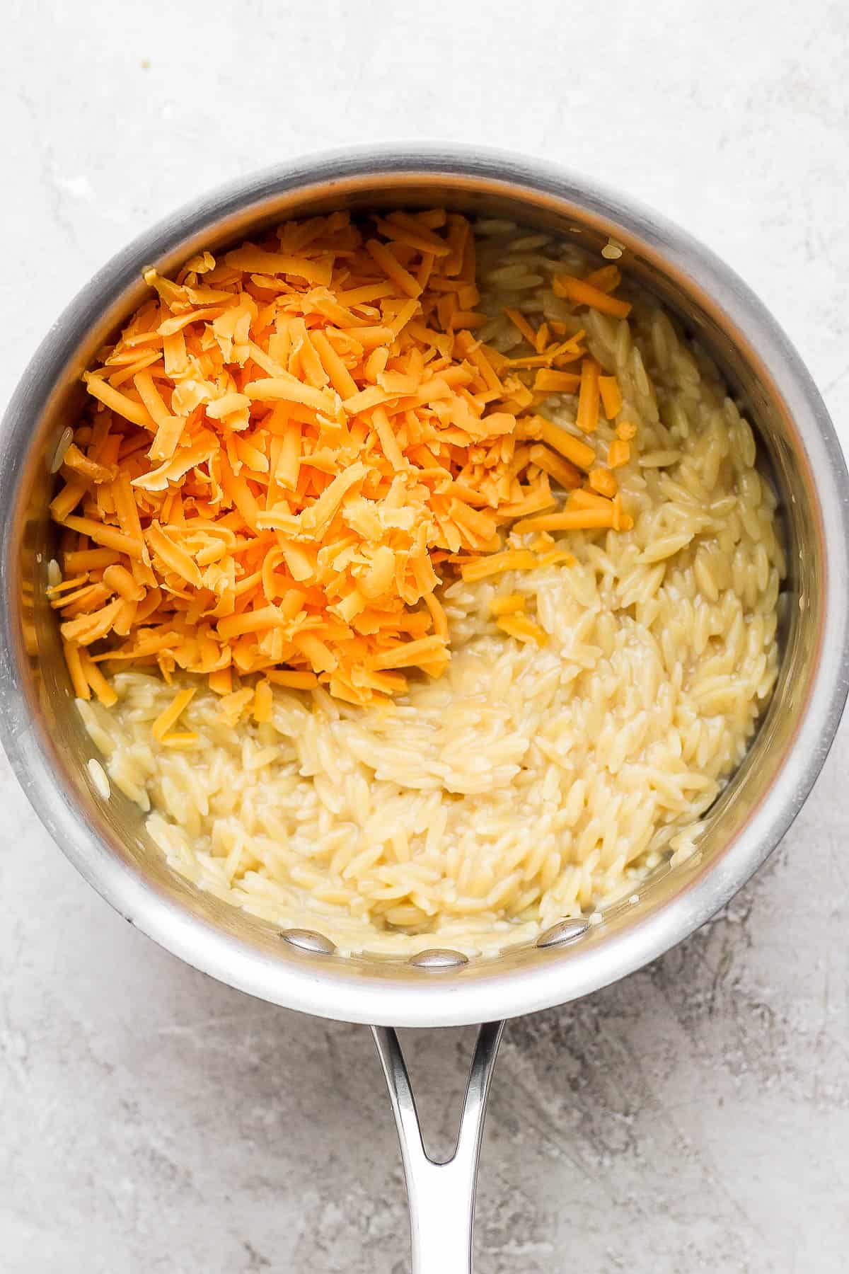 Drained orzo back in the pot with the cheese added.