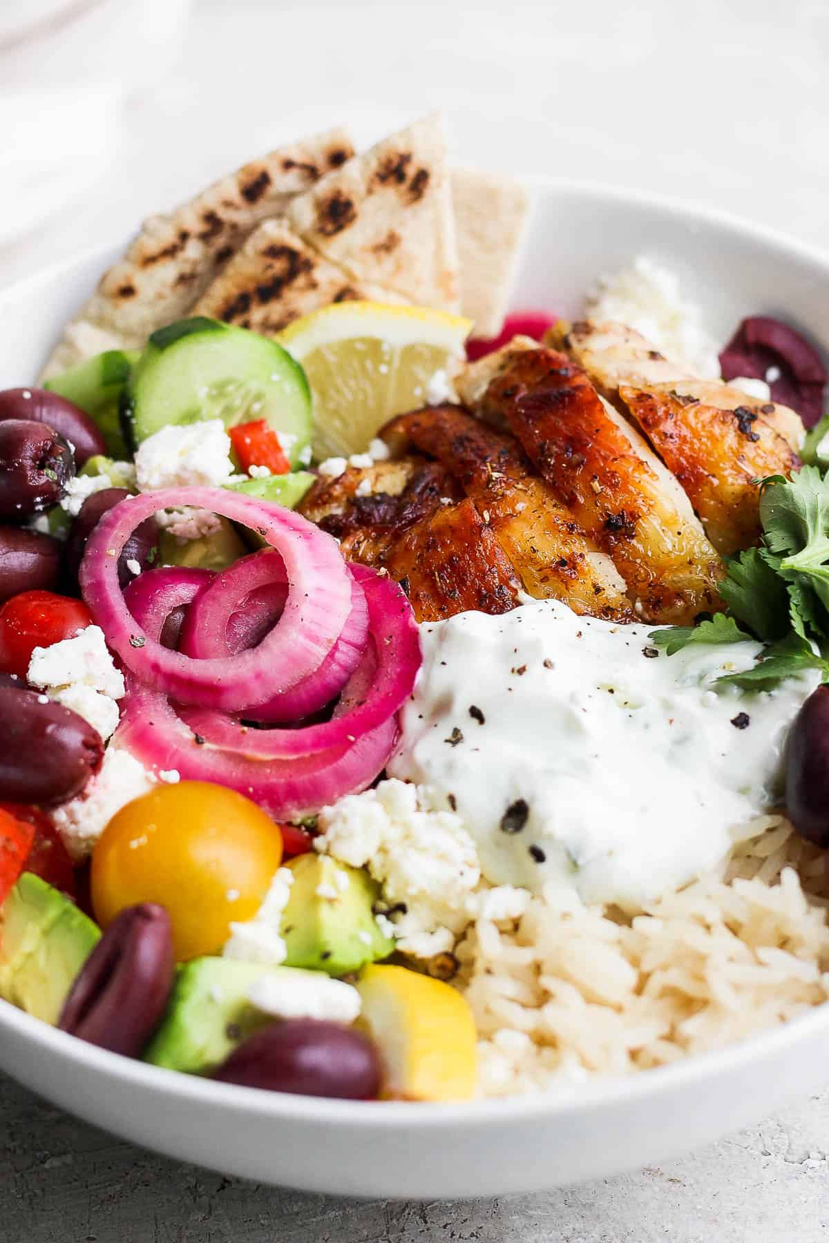 https://thewoodenskillet.com/wp-content/uploads/2023/02/best-greek-chicken-rice-bowl-recipe-3.jpg