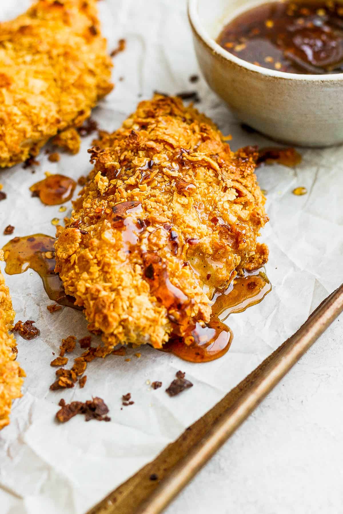 Hot honey sauce on cornflake-crusted chicken.