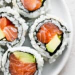 A plate of spicy salmon rolls.